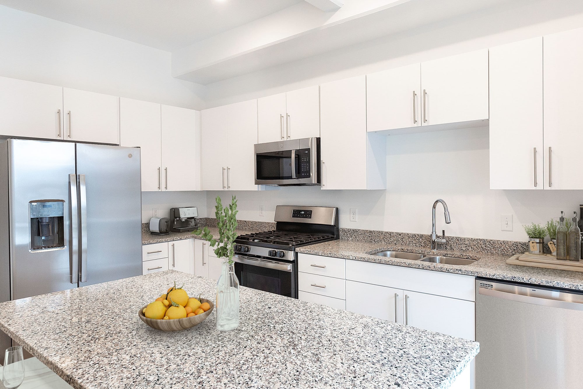 A kitchen with light-colored cabinetry at The Hardison in Salt Lake City, Utah