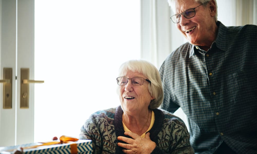 Resident receiving a gift at Randall Residence of Fremont in Fremont, Ohio