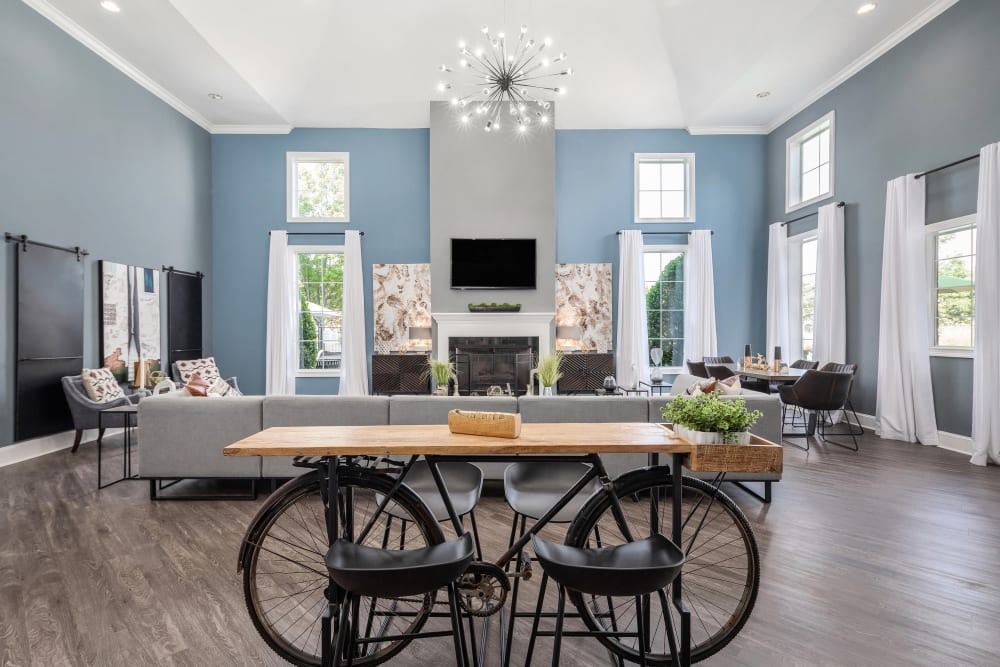 Well-furnished clubhouse lounge with a fireplace at Highlands at Alexander Pointe in Charlotte, North Carolina
