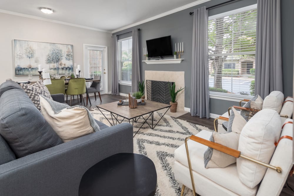 Clubhouse lounge area with a flatscreen TV above the fireplace at Highlands at Alexander Pointe in Charlotte, North Carolina