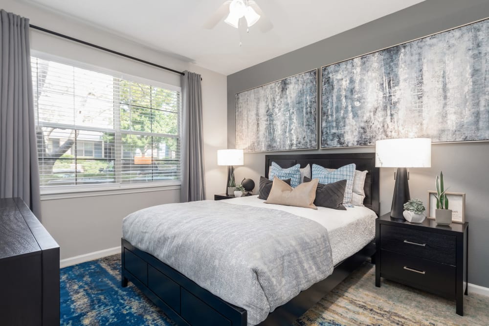 Primary bedroom with large bay windows in a model home at Highlands at Alexander Pointe in Charlotte, North Carolina