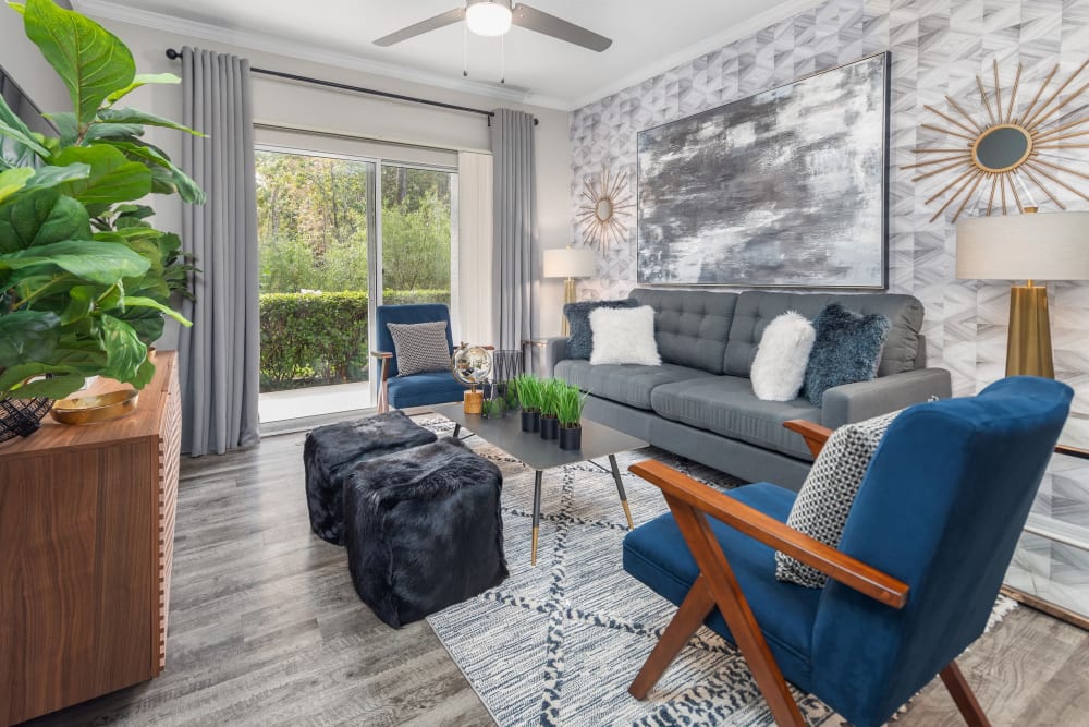 Hardwood floors in living room with porch access at Mezza in Jacksonville, Florida