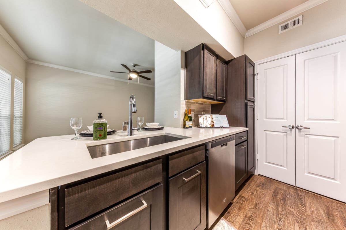 Modern kitchen with white countertops at Marquis on Memorial in Houston, Texas