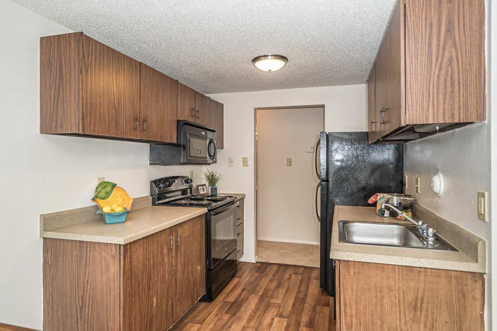 Kitchen with black appliances at Waterford West in Manchester, Missouri
