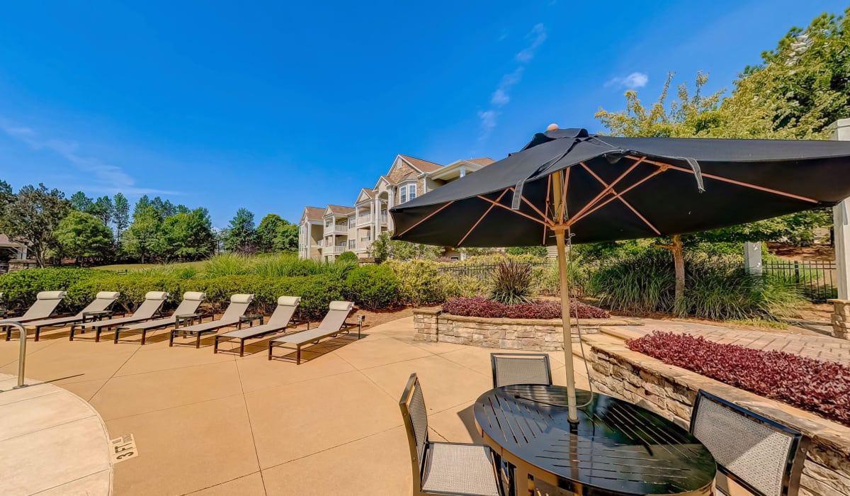 Resort style swimming pool lounge beds at Madison Park in Madison, Alabama