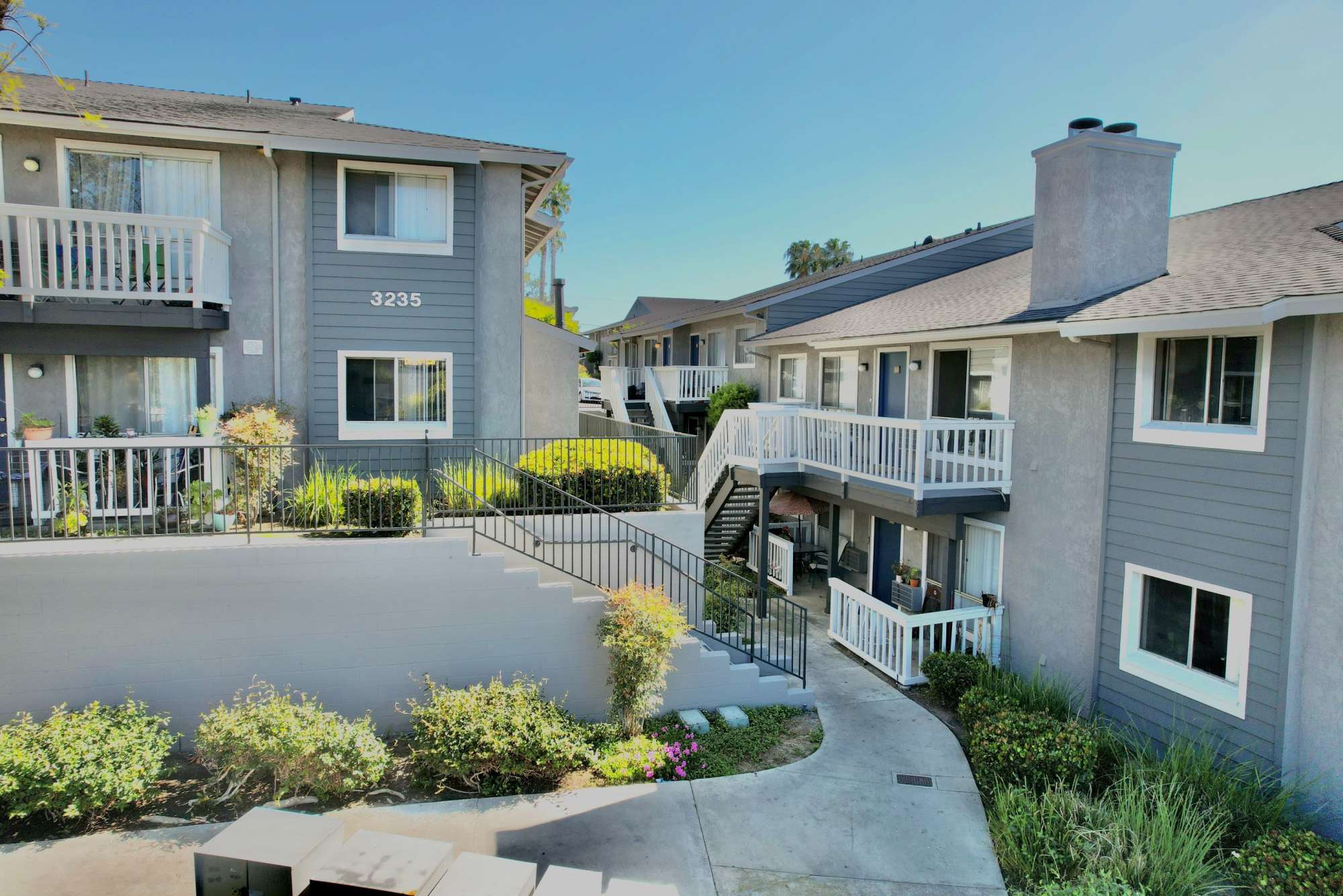 Walkways through the landscaped property at Hillside Terrace Apartments in Lemon Grove, California