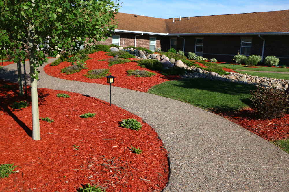 Exterior of residences with walking path at Addington Place of Clinton in Clinton, Iowa.