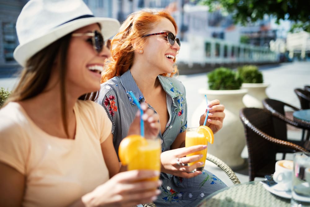 Residents enjoying lunch at the outdoor lounge at 770 C Street Apartments in Washington, District of Columbia