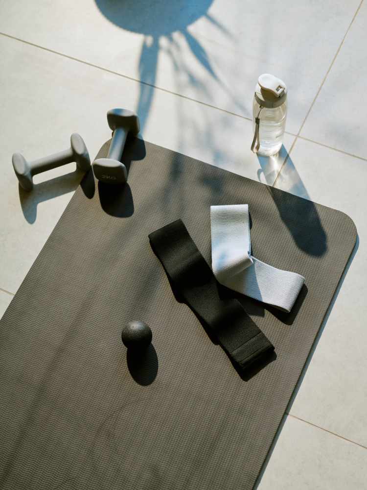 A yoga mat, free weights and exercise bands at The Colton in Redwood City, California