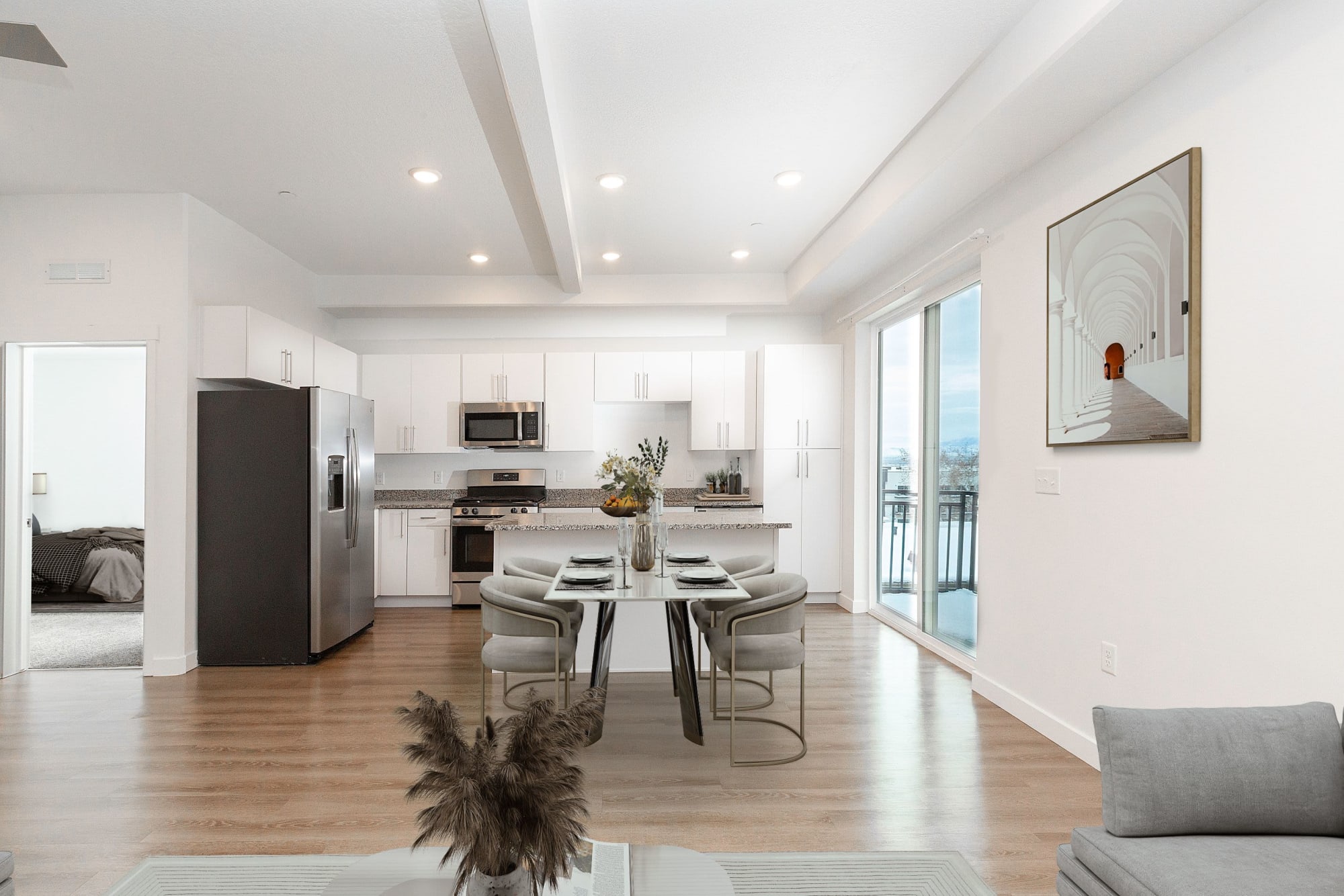 Kitchen and dining room view of model home at The Hardison