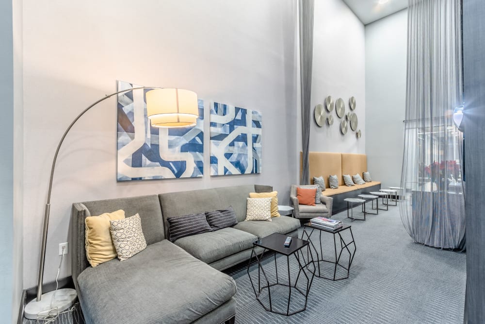 Lounge area with sofa and hanging lamp at Anthem Cityline in Richardson, Texas