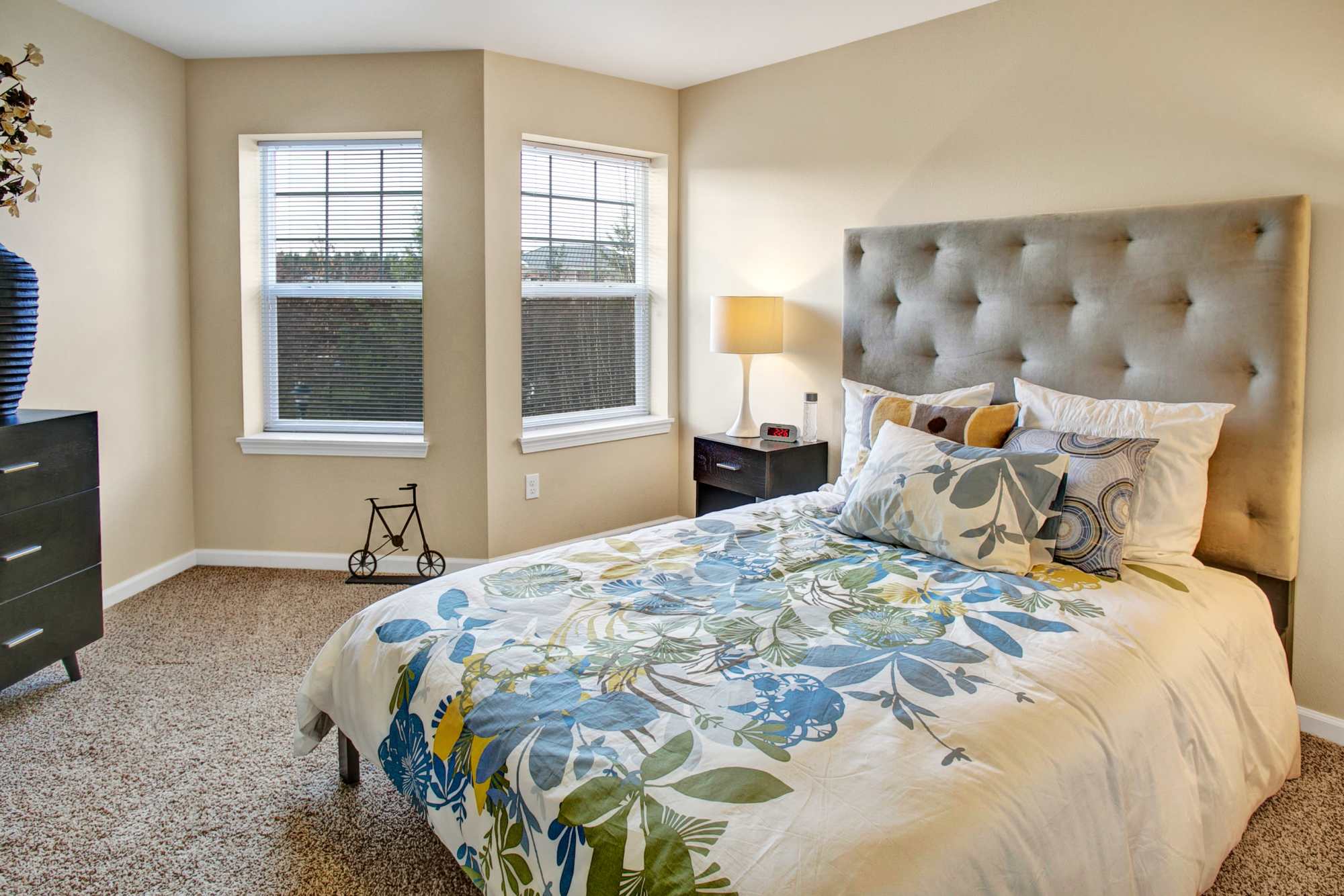 Bedroom with carpet flooring at Trax at Dupont Station in Dupont, Washington