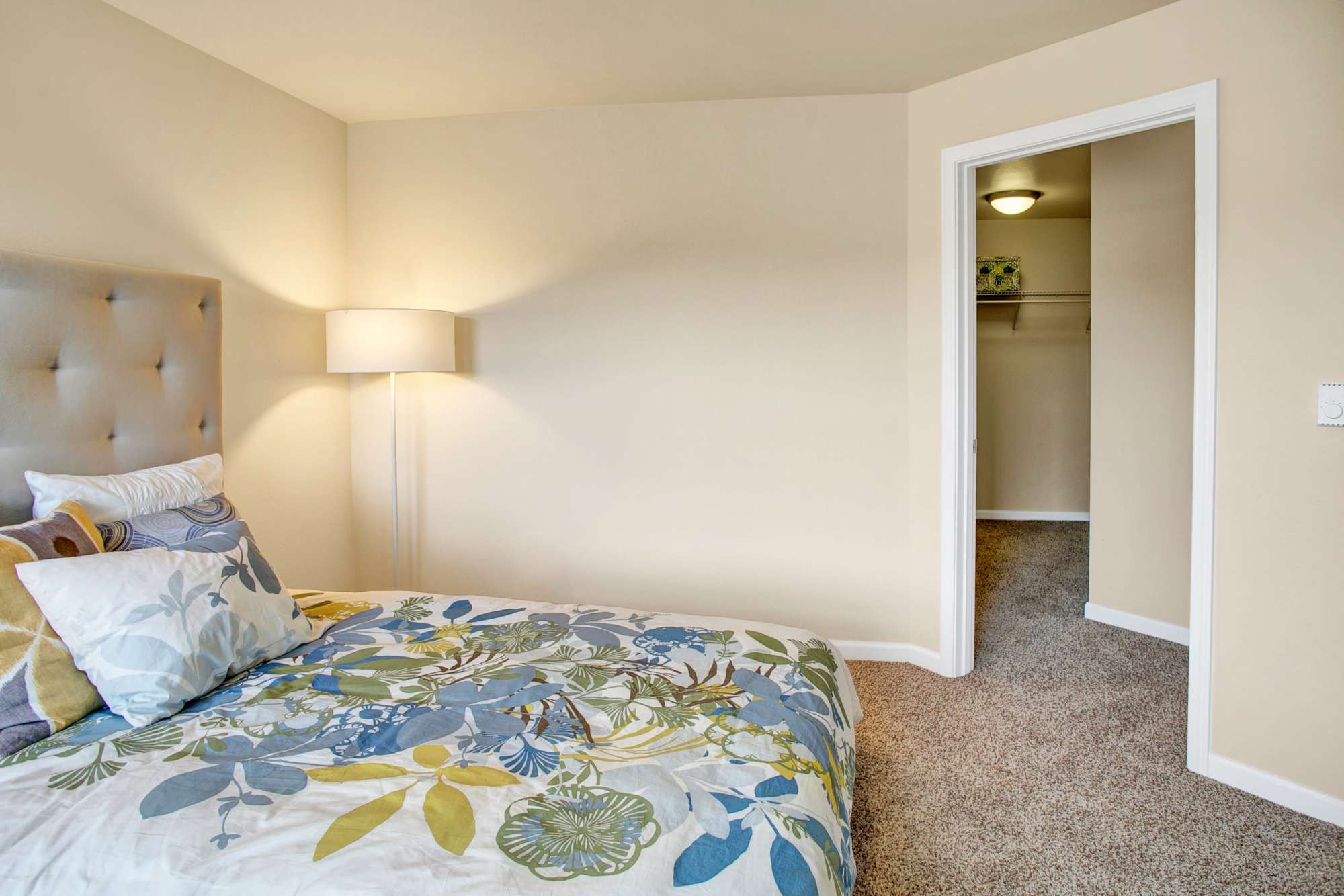 Bedroom with walk-in closet at Trax at Dupont Station in Dupont, Washington