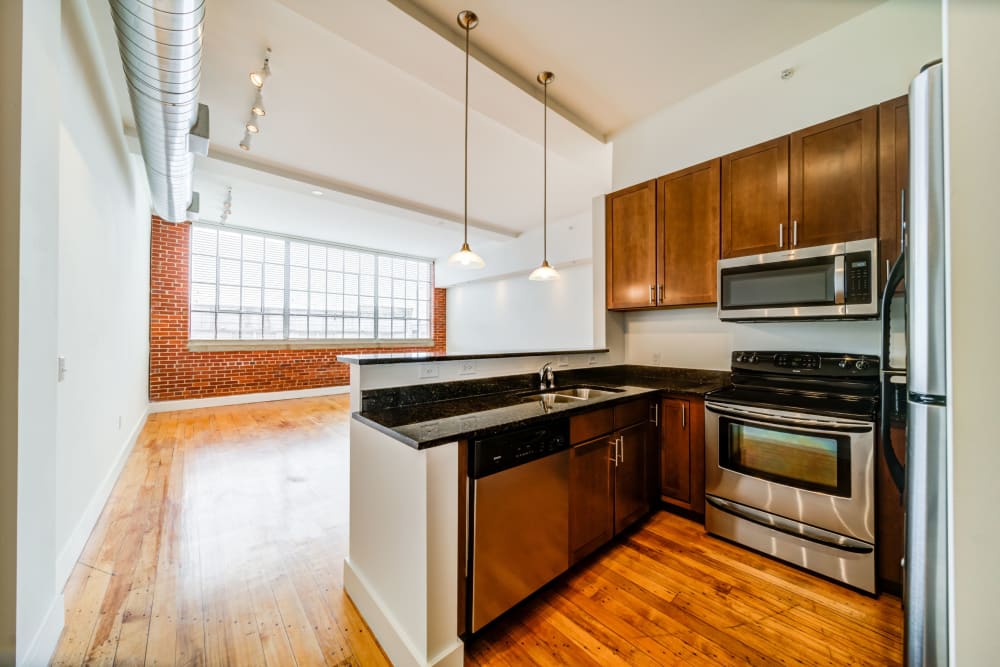 Model kitchen with wood floors at The Gallery Lofts in Winston Salem, North Carolina