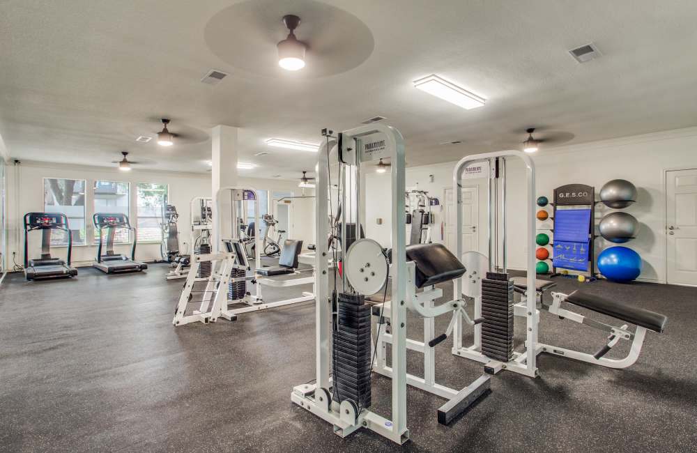 Fully-equipped gym with treadmills, weight machines at Ascent at Lake Worth in Fort Worth, Texas