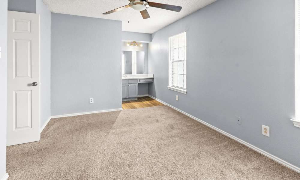 Bedroom with ceiling fan at North Hills Place in Richland Hills, Texas