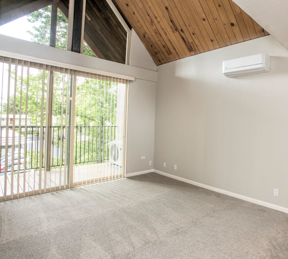 Spacious living with high-ceilings and patio access at Atrium Downtown in Walnut Creek, California