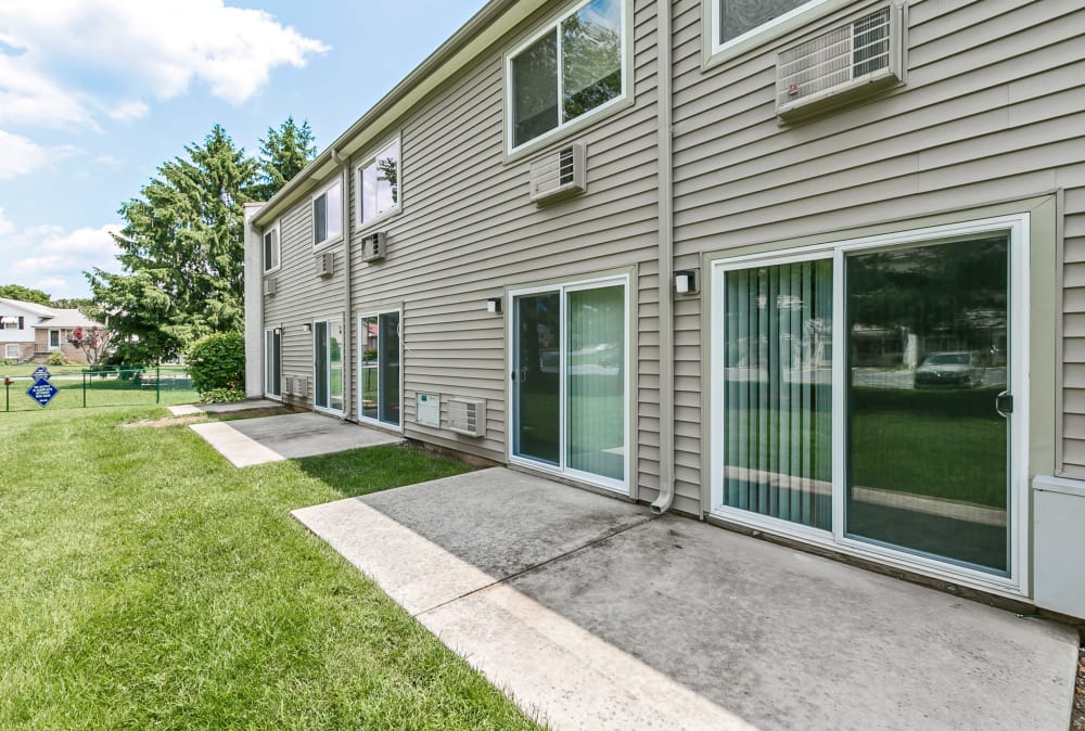 Exterior with private patios at Lincoln Park Apartments & Townhomes in West Lawn, Pennsylvania