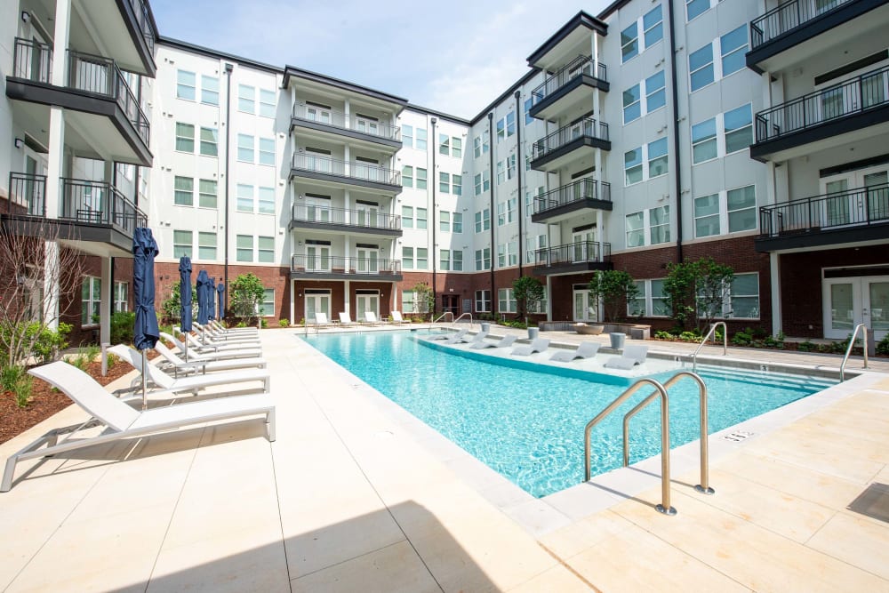 Pool with pool chairs on a sunny day