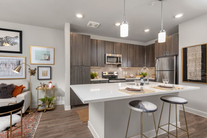 Open concept chefs kitchen with living room at Domain at Founders Parc in Euless, Texas