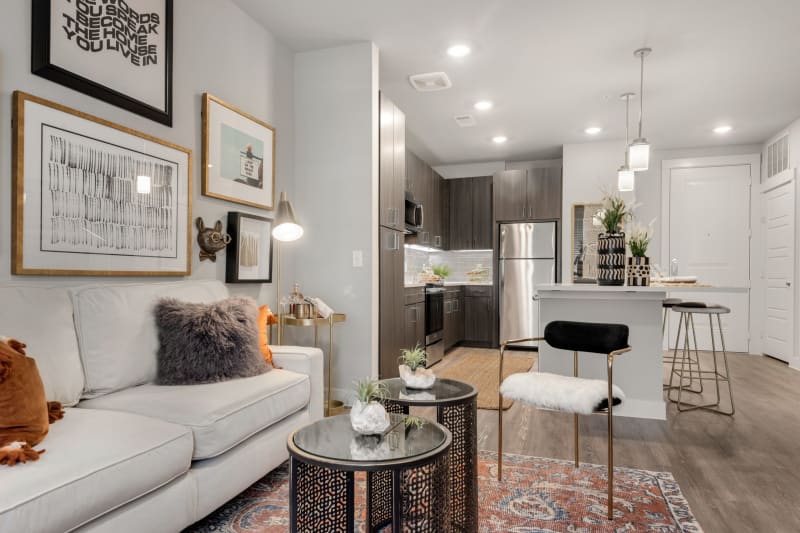 Spacious living room and kitchen area in a model home at Domain at Founders Parc in Euless, Texas