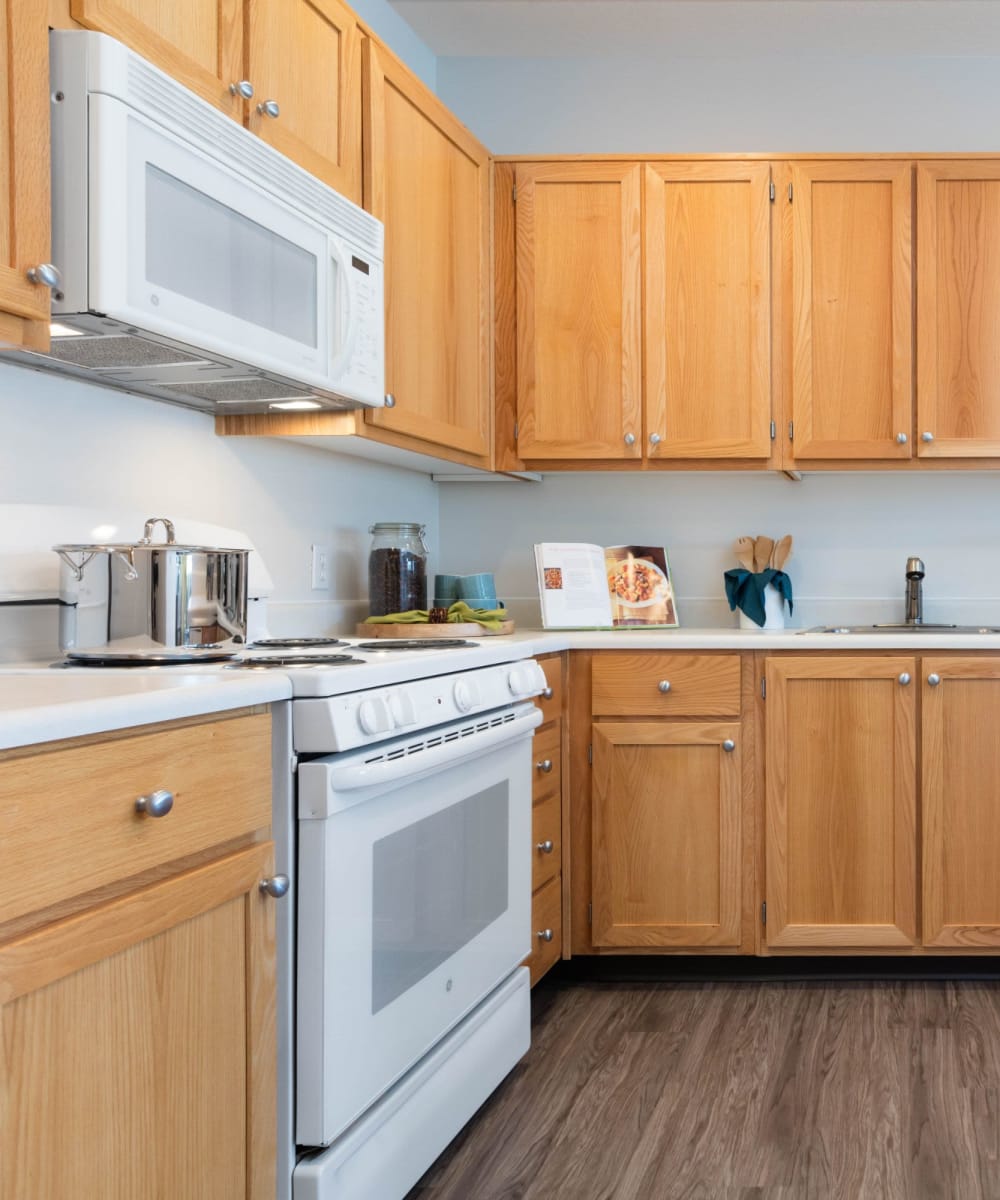 Model home's kitchen with ample natural light at Avery at Orenco Station in Hillsboro, Oregon