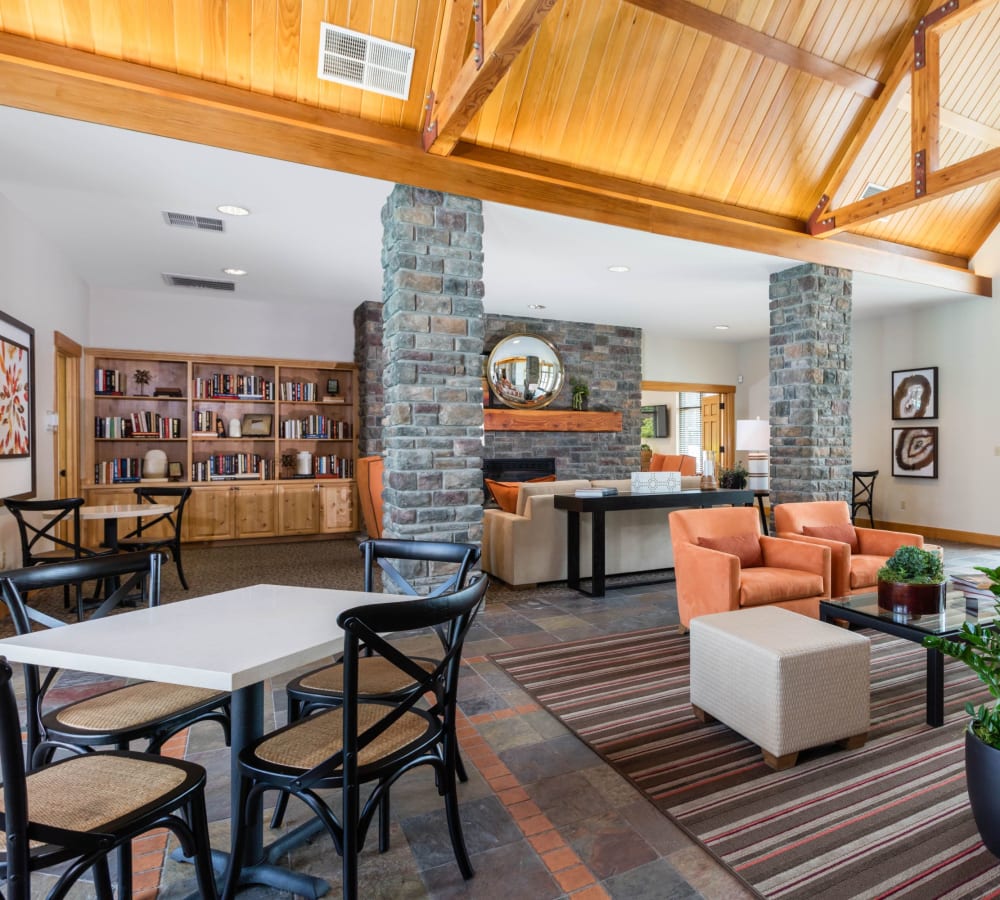 Beautiful rustic resident lounge with bookshelves at Avery at Orenco Station in Hillsboro, Oregon