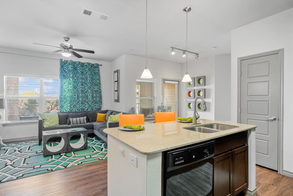 View of living room and dining area from kitchen island at The BLVD in San Angelo, Texas
