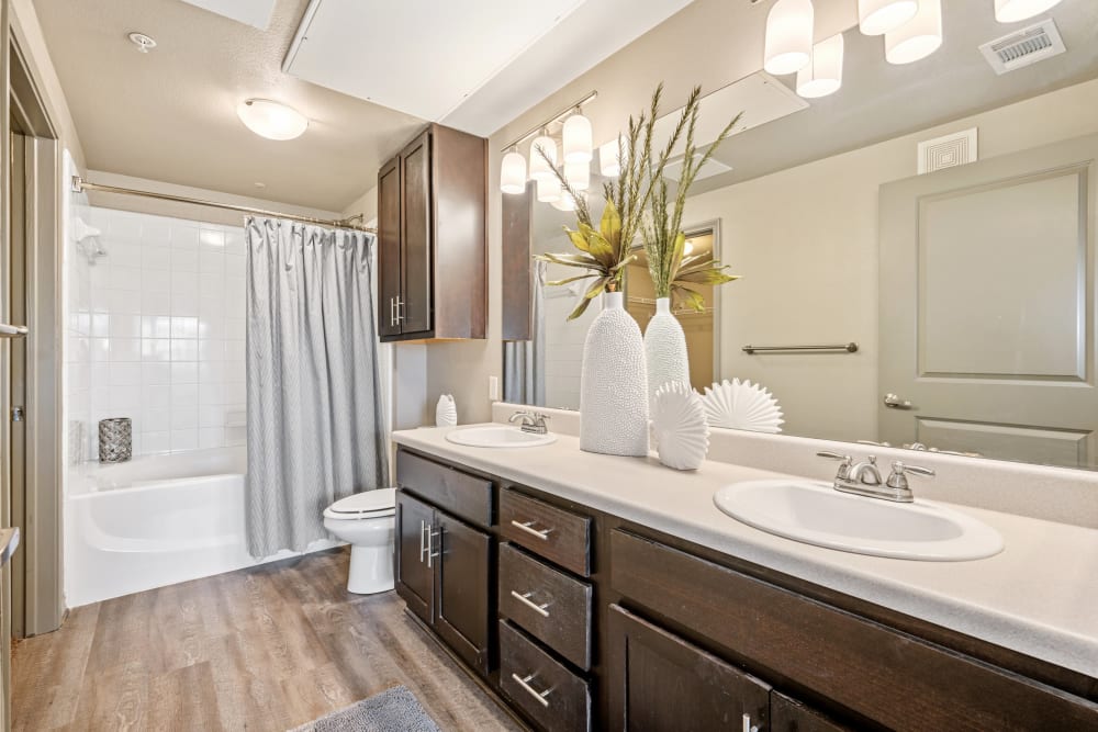 Model bathroom with ample cabinetry at The BLVD in San Angelo, Texas