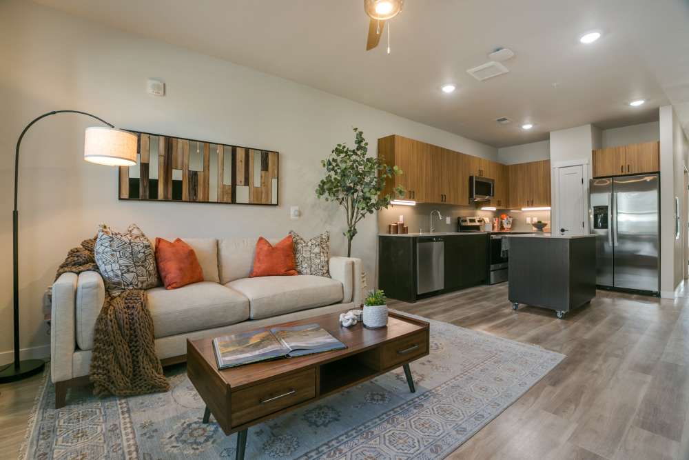 Modal living room with access to kitchen at Olympus Latitude in Albuquerque, New Mexico