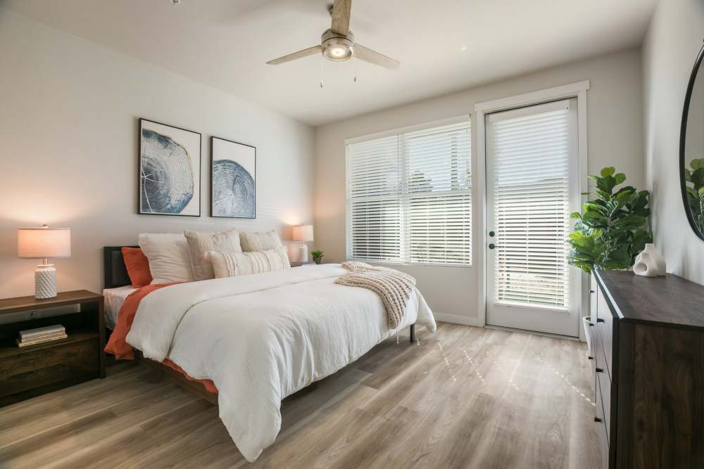 Bedroom with wood-style flooring at Olympus Latitude in Albuquerque, New Mexico