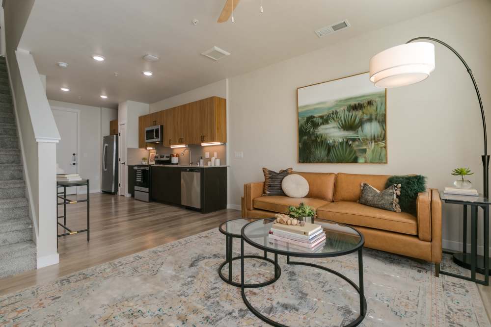 Modal living room with plush carpeting at Olympus Latitude in Albuquerque, New Mexico