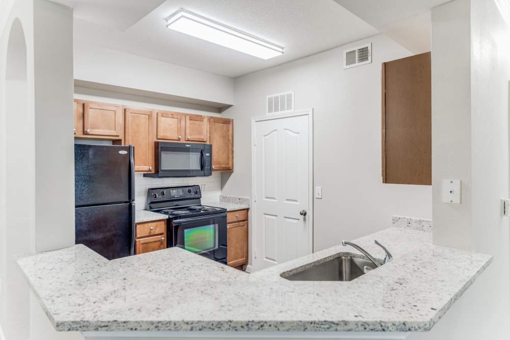 Apartment kitchen at Club at Stone Oak in San Antonio, Texas