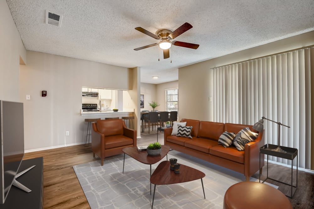 Well-styled apartment living room at Leander Apartment Homes in Benbrook, Texas