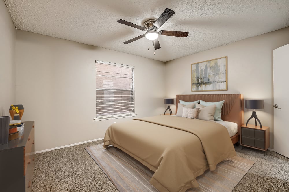 Comfortable bedroom  at Leander Apartment Homes in Benbrook, Texas