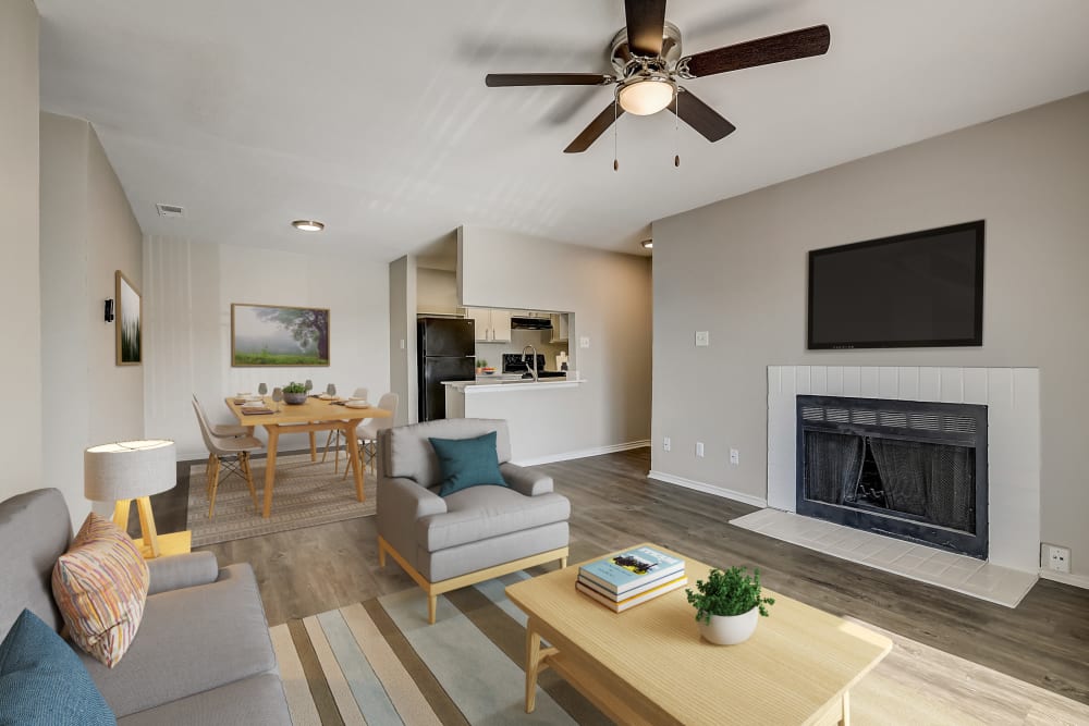 Bright beautiful room with fireplace at Leander Apartment Homes in Benbrook, Texas