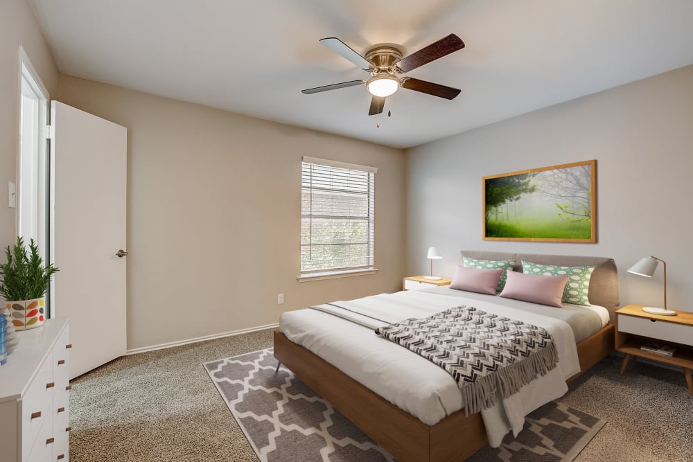 Relaxing bedroom at Leander Apartment Homes in Benbrook, Texas