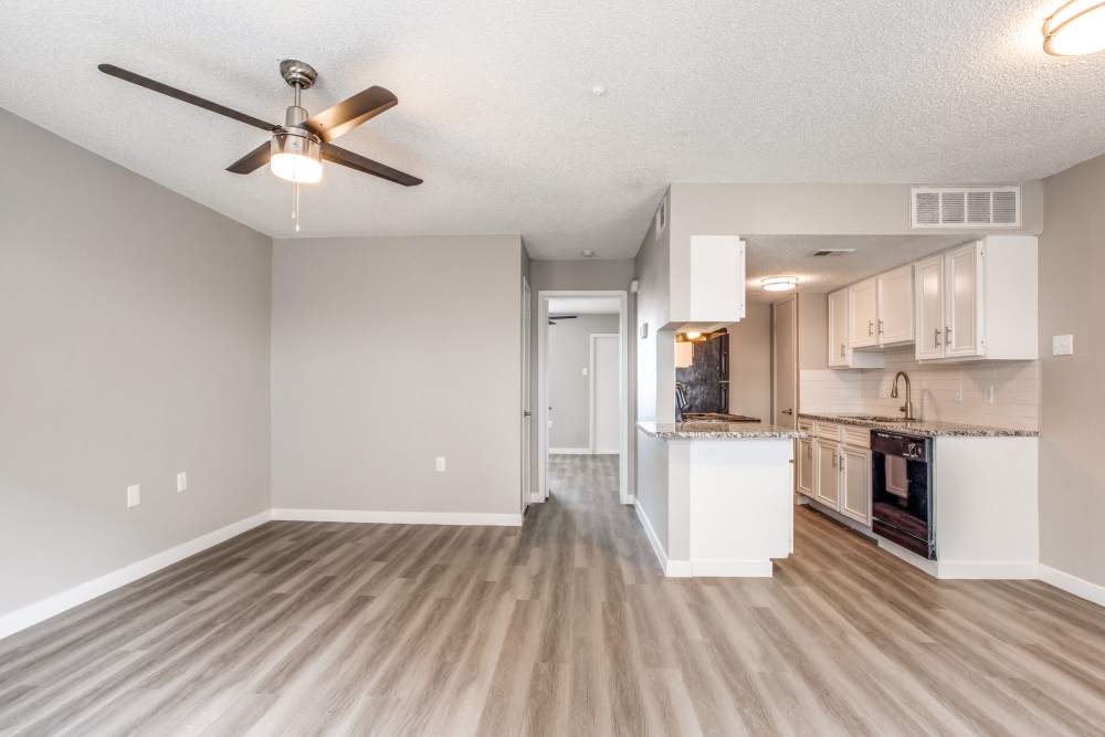 Unfurnished living room with view of kitchen at Villa De Oro in San Antonio, Texas