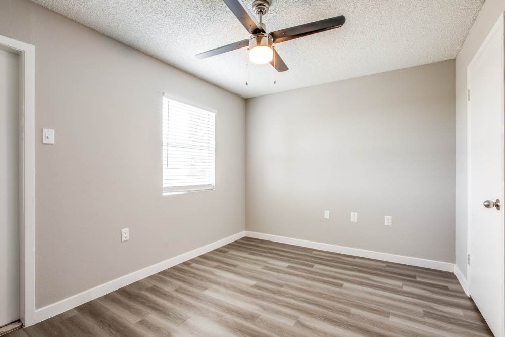Unfurnished bedroom with large window at Villa De Oro in San Antonio, Texas