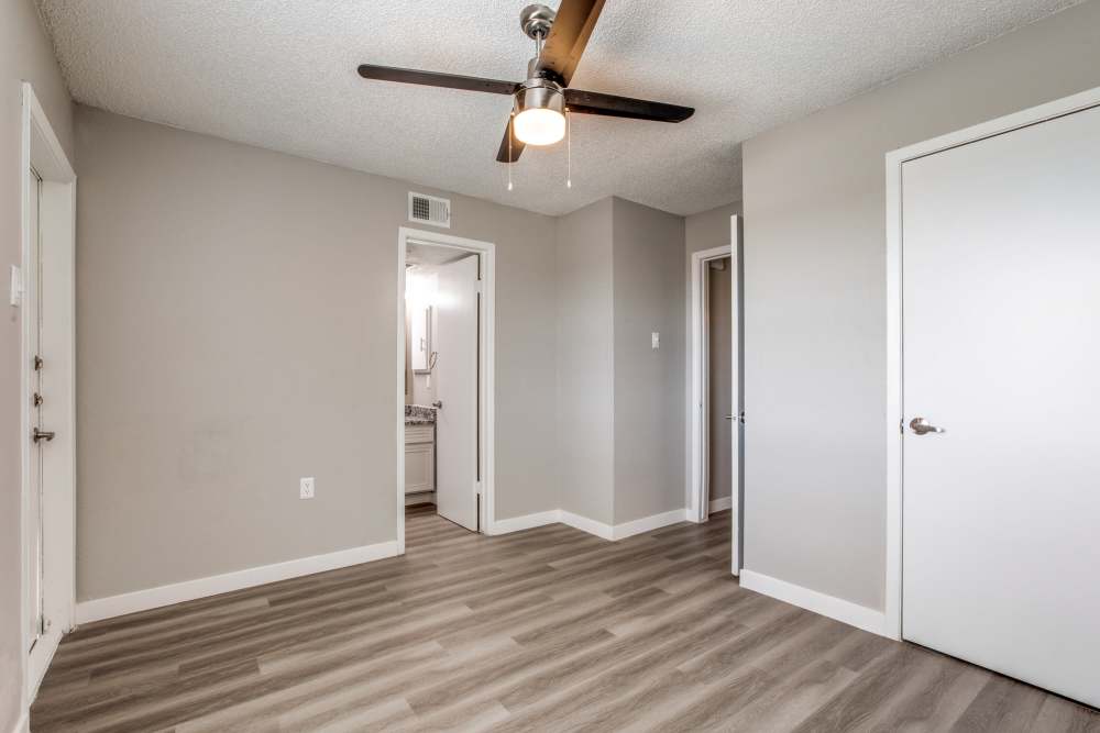 Unfurnished bedroom with attached bathroom at Villa De Oro in San Antonio, Texas