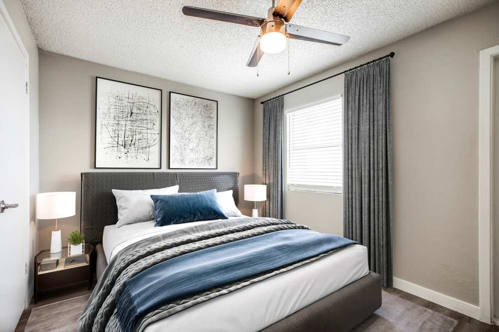Specious bedroom with cozy bed at Villa De Oro in San Antonio, Texas