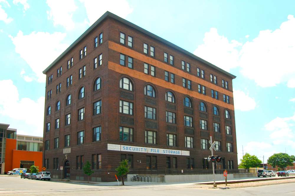 Brick building with arched windows at Rumely Lofts in Des Moines, Iowa