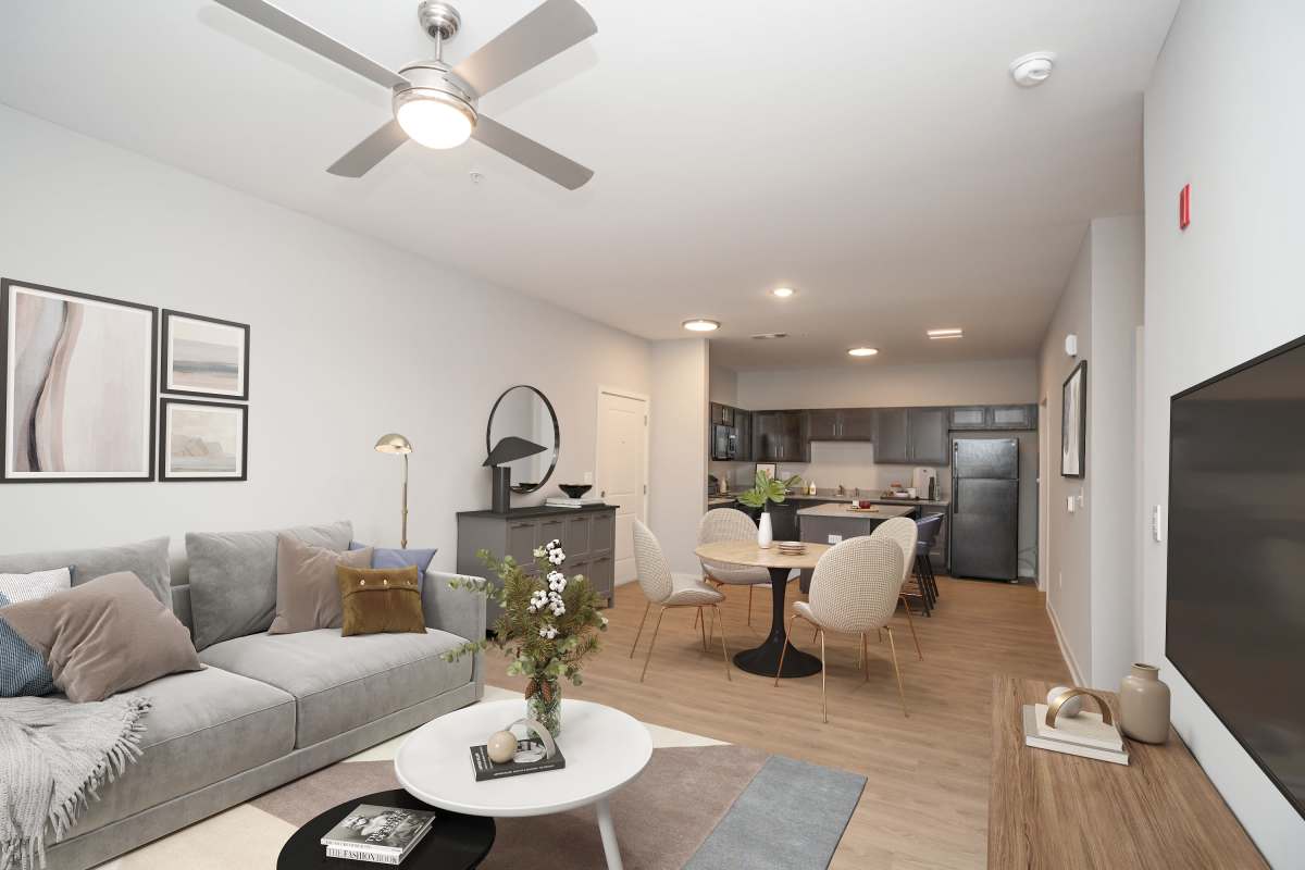 Living room with connecting kitchen at Donerail Run in Louisville, Kentucky