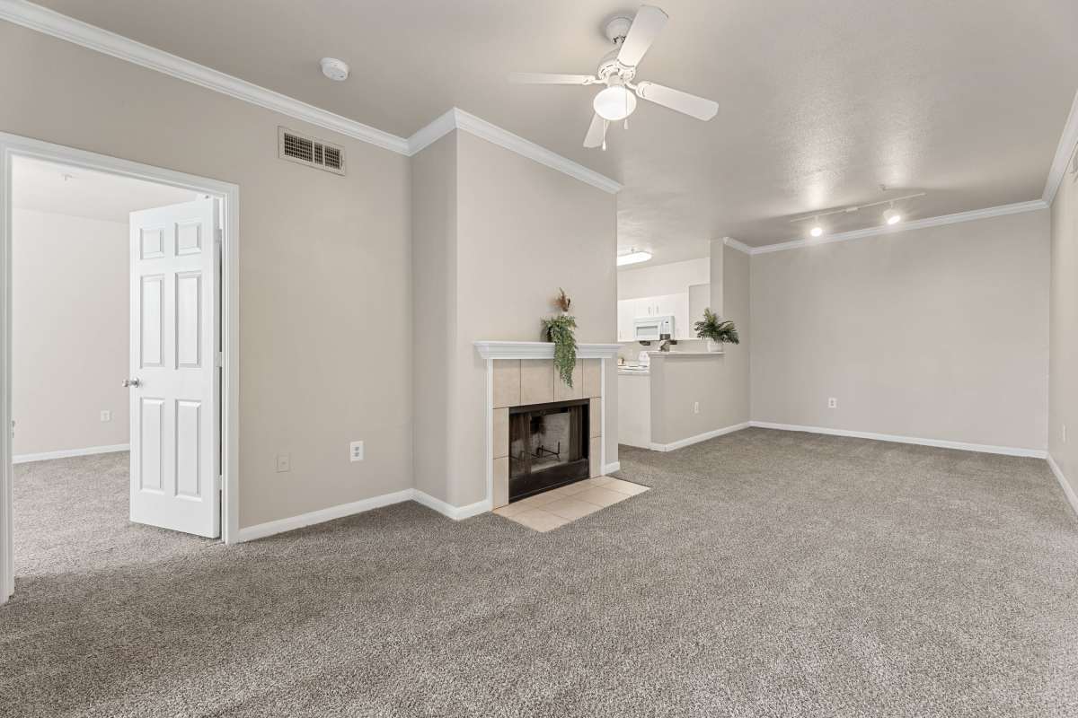 Spacious living room with fireplace at Columbia Greens in Houston, Texas