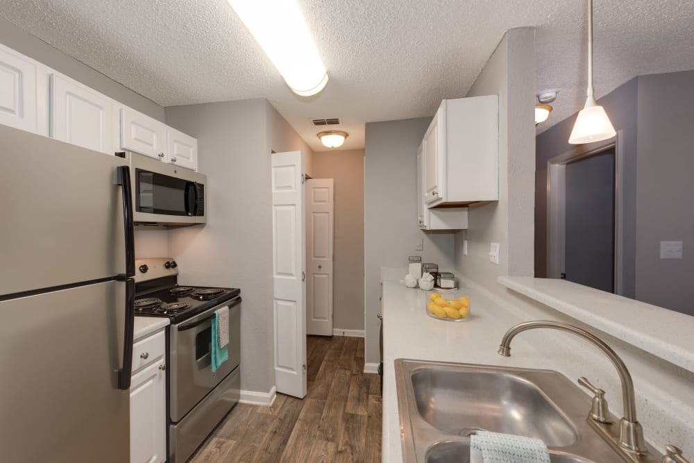 Model kitchen with stainless-steel appliances at Andover Woods in Charlotte, North Carolina