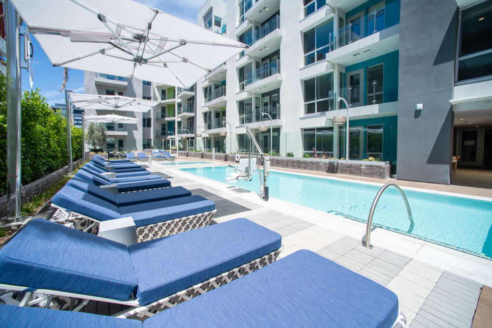 Beautiful swimming pool and outdoor seating at The Pacific in Long Beach, California