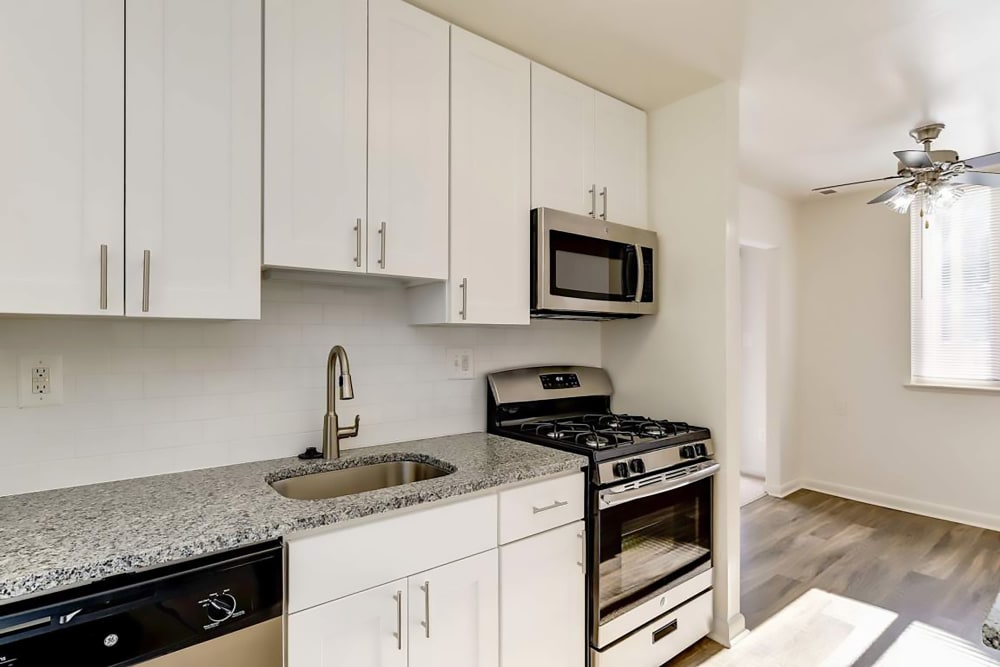 Model kitchen with granite countertops at Hallfield Apartments in Perry Hall, Maryland