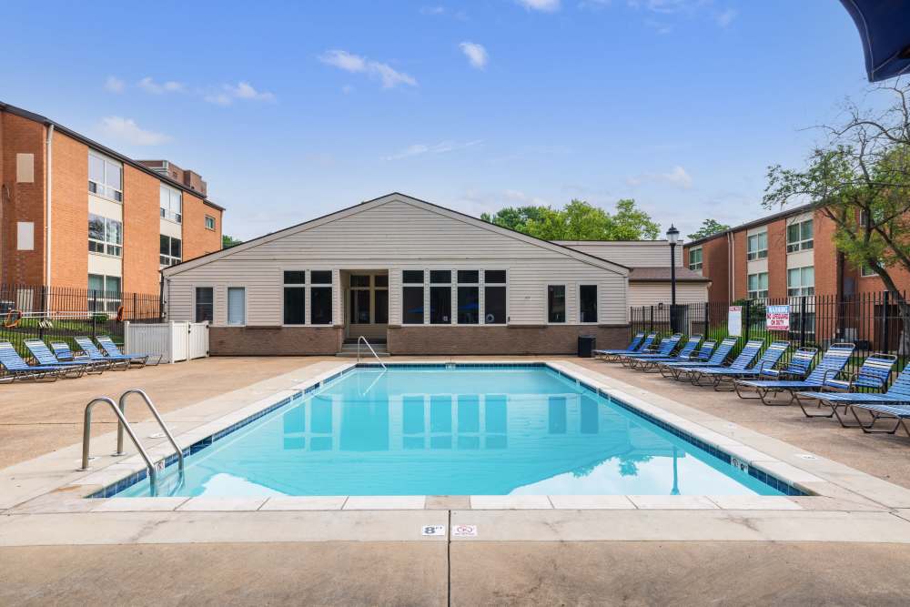 Swimming pool with lounge seating at West End Terrace Apartments in St. Louis, Missouri