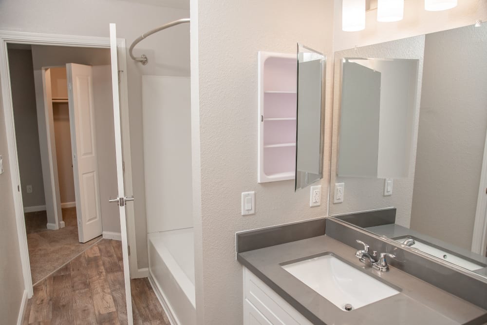 Bathroom with a Vanity mirror and oval tub at Shaliko in Rocklin, California