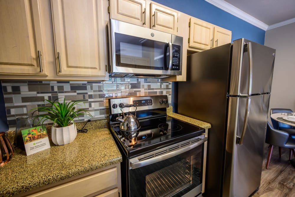Ample cabinet and cupboard storage in a model home's kitchen at 23Hundred @ Ridgeview in Plano, Texas